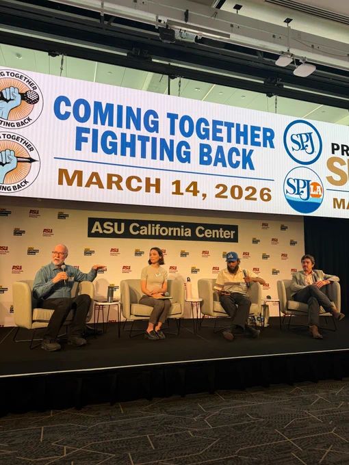 Three men and one woman sit on chairs on a stage in front of a sign that reads ASU California Center. The text on the screen above them reads Coming Together Fighting Back March 14, 2026

