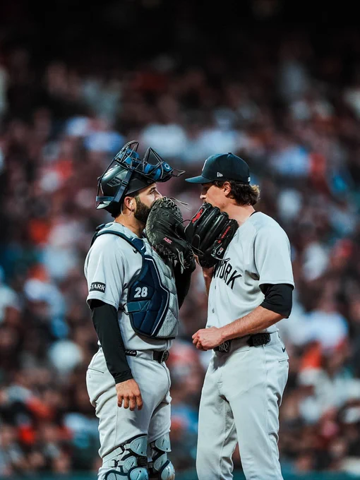 Austin Wells and Max Fried chat on the mound. 