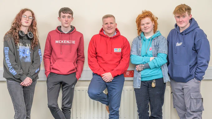 Commissioner Chris Quinn with four members of the NICCY Youth Panel. 
