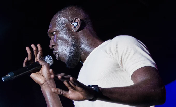 Stormzy on stage with microphone
