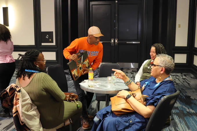 #AWP26 HBCU creative advisor MK Asante speaking with three other people at the HBCU reception