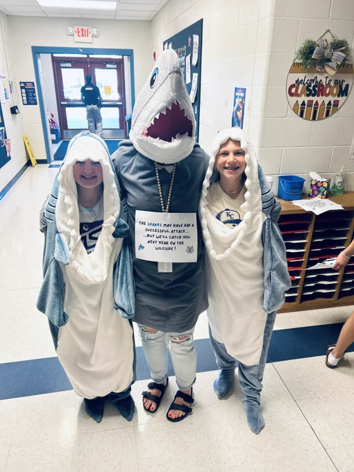 Teacher and students dressed as sharks
