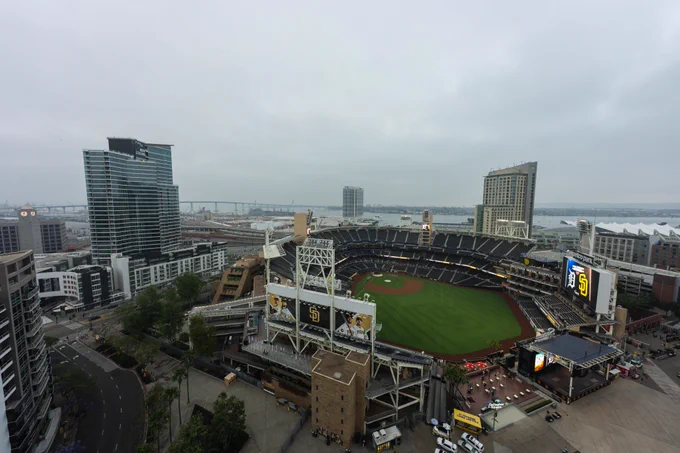 Sunrise photo over Petco Park on Opening Day 2026. The board in the ballpark shows today's matchup: Detroit Tigers vs. San Diego Padres.