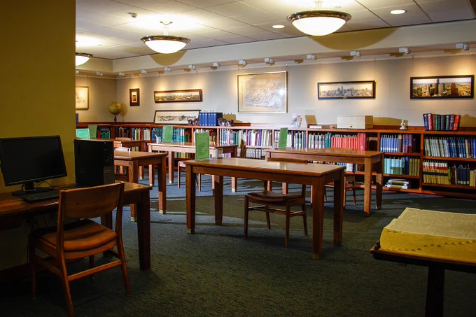 reading room with tables, chairs, bookshelves