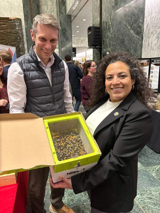 Scott McArt poses with Senator Nathalia Fernandez