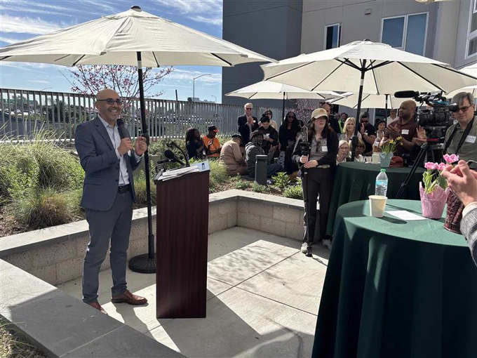HCD Director Gustavo Velasquez speaking at the grand opening ceremony
