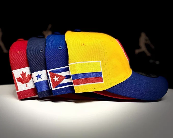 Four World Baseball Classic team caps: Team Canada, Team Panama, Team Cuba, Team Colombia 
