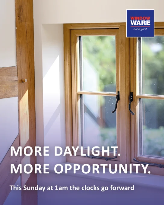 Sunlight streaming through a wooden-framed window with the words: More Daylight, More Opportunity and a reminder from Window Ware that clocks go forward at 1am this sunday. 