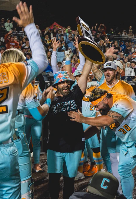 Anthony Marks holding banana ball trophy