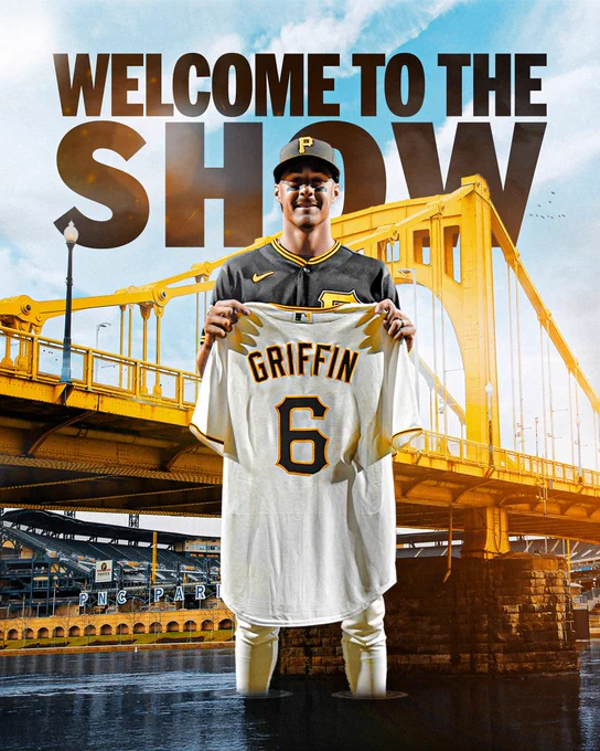 Welcome to the Show: Konnor Griffin, Pirates 
Pictured: Konnor Griffin is pictured holding his home white Pirates jersey while standing in front of the Roberto Clemente Bridge outside of PNC Park. He wears a black alternate Pirates uniform with yellow lettering.