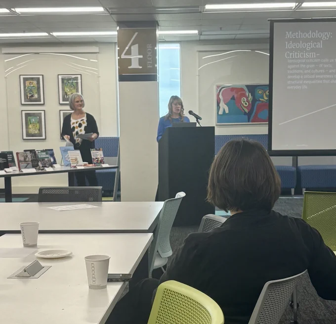 Valerie Palmer-Mheta and Jennifer Heisler from Communication Journalism and Public Relations presenting their work. 