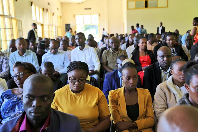 Participants follow the meeting attentively, reflecting focus & commitment as they consider how to keep working their best to improve the education system.