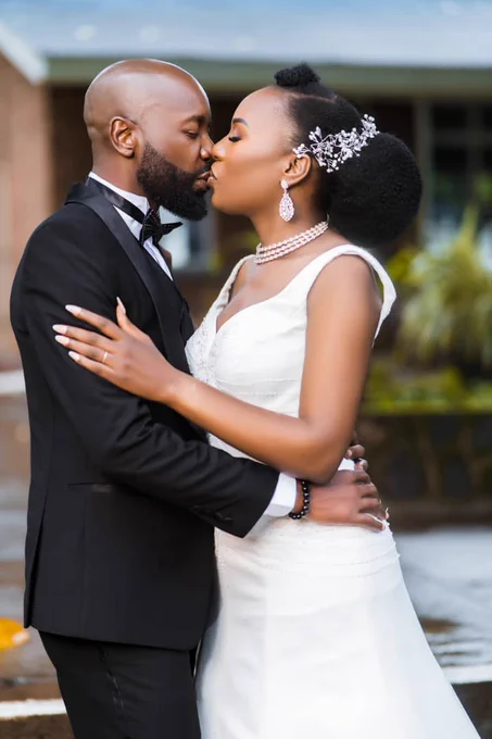 A wedded couple kissing