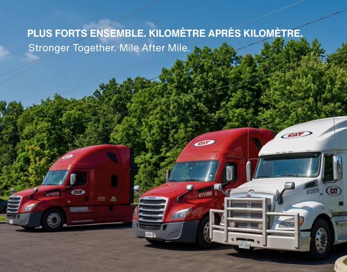 A lineup of three C.A.T. Inc. transport trucks parked side by side on a sunny day. Two red trucks and one white truck stand in front of a dense green forest. Text at the top reads “Plus forts ensemble. Kilomètre après kilomètre.” and below it “Stronger Together. Mile After Mile