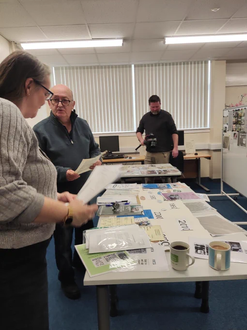 Filming the recording of Leighton memories. Photos are placed around the library
