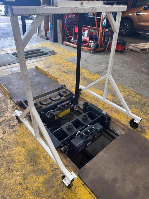 An old garage pit jack being replaced with a new heavy duty Majorlift model by garage equipment supplier Gott Technical Services