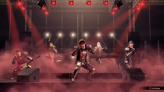 A scene from Like a Dragon: Infinite Wealth where Ichiban, dressed in a flashy outfit, performs on stage like a rock band mid-show.