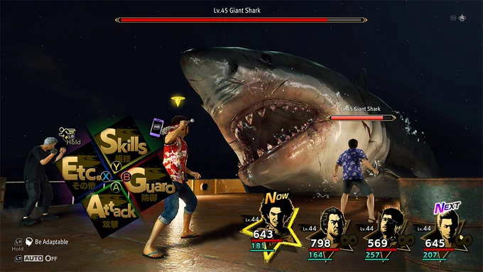 Gameplay from Like a Dragon: Infinite Wealth showing a turn-based battle on a dock at night as Ichiban faces a massive, open-mouthed shark enemy.