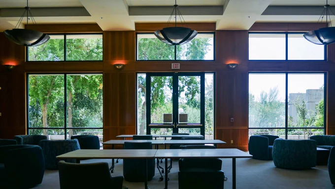 photo of the Dezember Reading Room in the Walter Stiern Library, facing south windows. credit: Bre Parks, Library staff