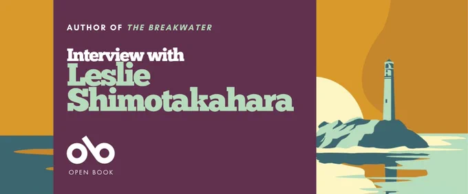 Banner for an interview with author Leslie Shimotakahara, featuring the text “Author of The Breakwater — Interview with Leslie Shimotakahara” and the Open Book logo. The right side shows an illustrated lighthouse on a rocky island surrounded by calm water, with a large sun and warm orange sky in the background.

