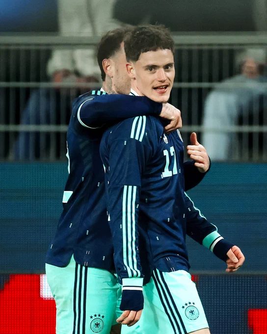 Photography of Florian Wirtz celebrating his goal for Germany.