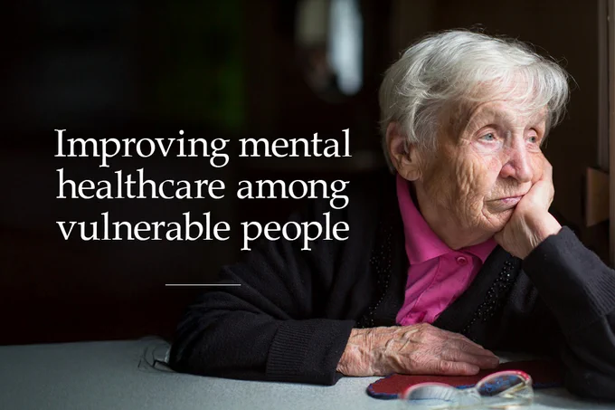 An elderly person sits thoughtfully at a table, resting their head on their hand. The text reads, "Improving mental healthcare among vulnerable people." Glasses and a book are nearby.