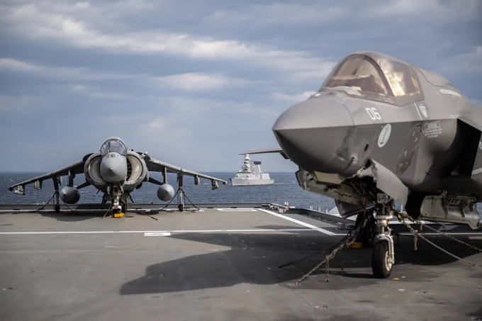 Italian F-35B and Harrier II on the deck of ITS Cavour, ITS Ciao Duilio beyond.

Credit: Italian Navy