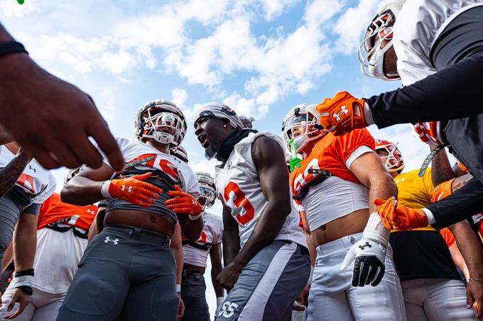 Team huddle with players hyping each other up during practice.