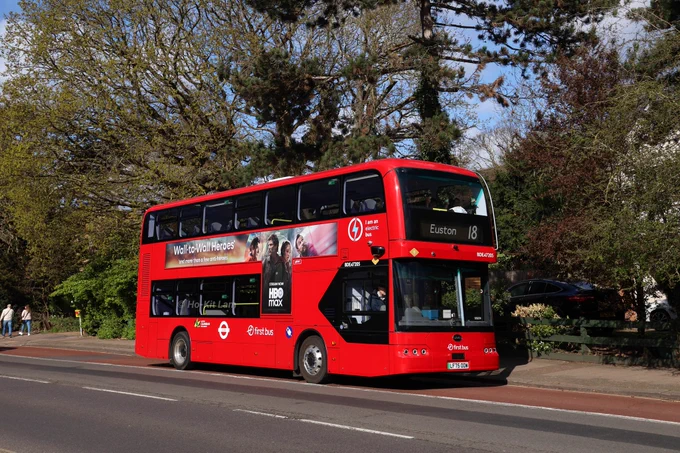 First Bus London BDE47205 (LF75OOW) is a red BYD BD11 and is pictured on Wembley High Road as it heads to Euston on route 18.