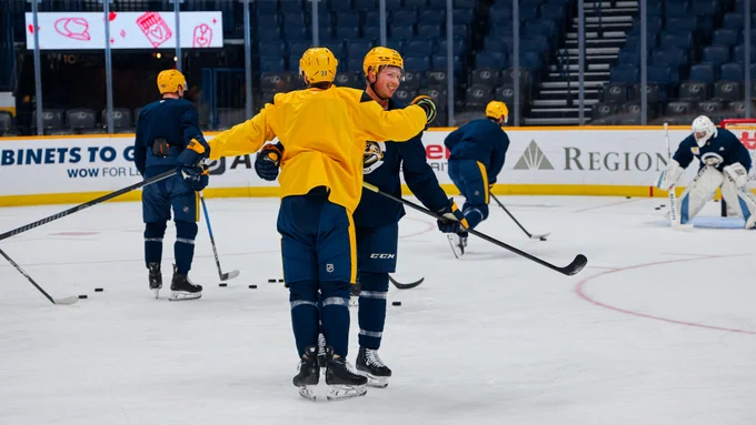 Image of Matthew Wood and Reid Schaefer on the ice during morning skate today 