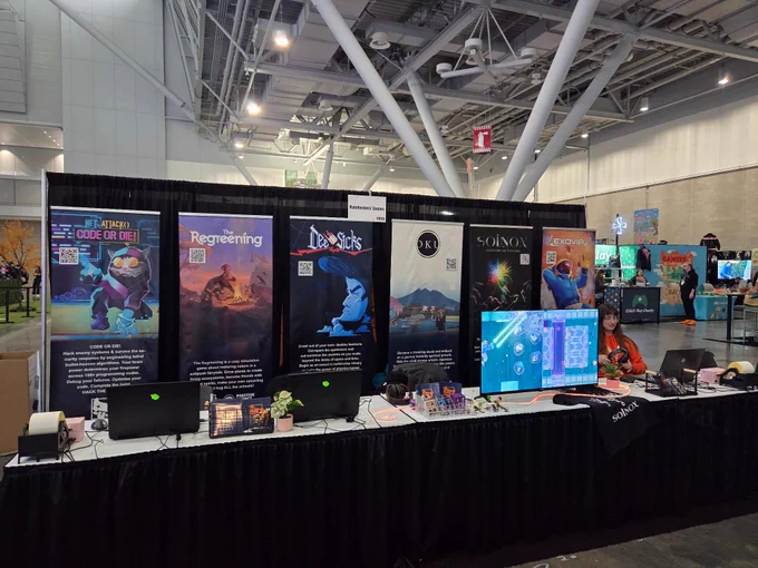 PAXEast booth before opening. Games: Net.Attack(), The Regreening, OKU, Solnox, Exovia