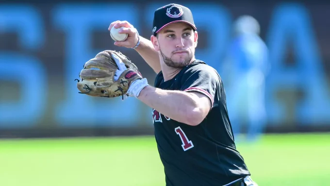 Zev Moore of MIT Baseball in a black #1 jersey preparing for a throw