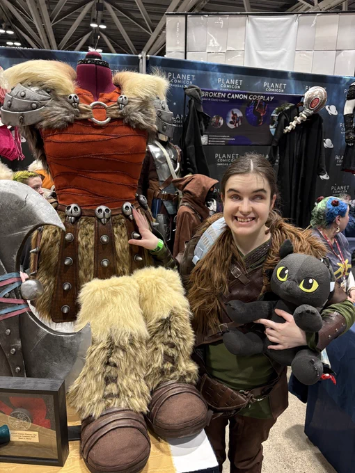 Hiccup and Astrid! I'm in my Hiccup cosplay holding my Toothless Build-A-Bear standing next to an Astrid cosplay on a mannequin! My right hand is on Astrid's waste!