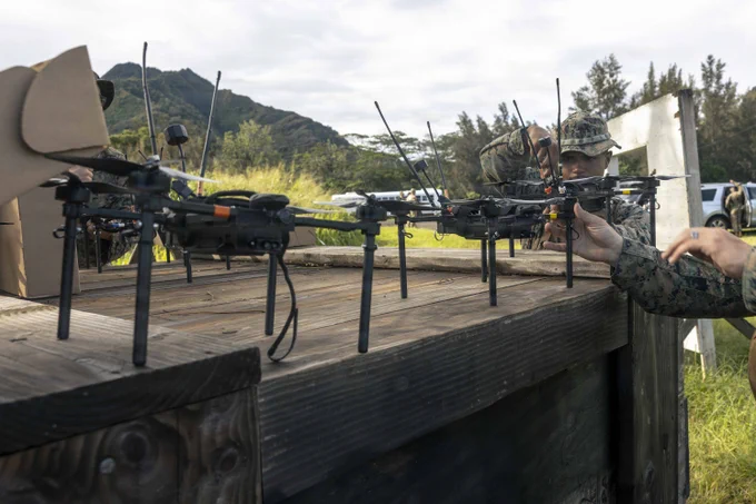 Neros Archer first-person view drones are organized during the Marine Corps Attack Drone Competition at Schofield Barracks, Hawaii, March 12, 2026. During a two-week period, the Marine Corps Attack Drone Team trained and certified U.S. Marines assigned to 3rd Littoral Combat Team, 3rd Marine Littoral Regiment, 3rd Marine Division, as attack drone operators, attack drone instructors, and payload specialist instructors increasing 3rd MLR's lethality and capacity of trained and certified attack drone operators and instructors. (U.S. Marine Corps photo by Sgt. Jonathan Beauchamp)