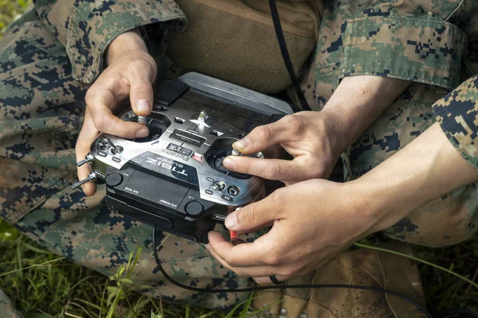 U.S. Marines with 3rd Littoral Combat Team, 3rd Marine Littoral Regiment, 3rd Marine Division, operate a Neros Archer first-person view drone during the Marine Corps Attack Drone Competition at Schofield Barracks, Hawaii, March 12, 2026. During a two-week period, the Marine Corps Attack Drone Team trained and certified U.S. Marines assigned to 3rd LCT as attack drone operators, attack drone instructors, and payload specialist instructors increasing 3rd MLR's lethality and capacity of trained and certified attack drone operators and instructors. (U.S. Marine Corps photo by Sgt. Jonathan Beauchamp)