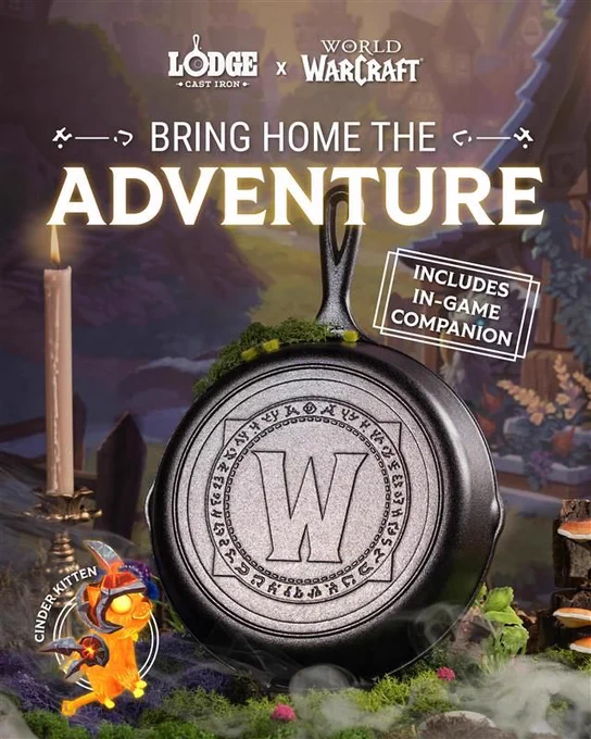 A black cast iron skillet with the Warcraft W logo on the bottom sits in the middle of the image surrounded by a candle stick, some green moss and smoke. In the bottom left corner is the image of a Cinder Kitten, a fiery orange cat with red armor. The image says Lodge Cast Iron x Warcraft, BRING HOME THE ADVENTURE. Includes in-game companion!