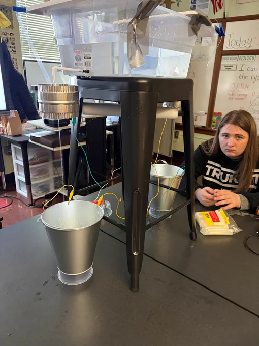 Student builds an electrical circuit.