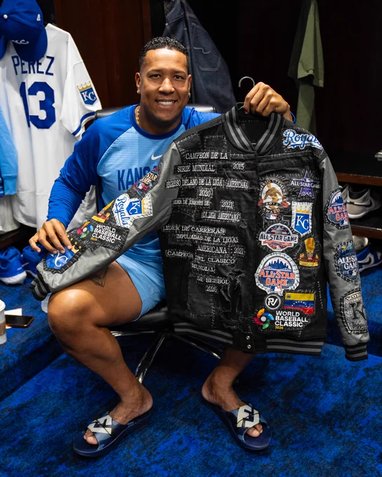 Salvador Perez shows off the details of his jacket. (Photo by Jason Hanna/Kansas City Royals)