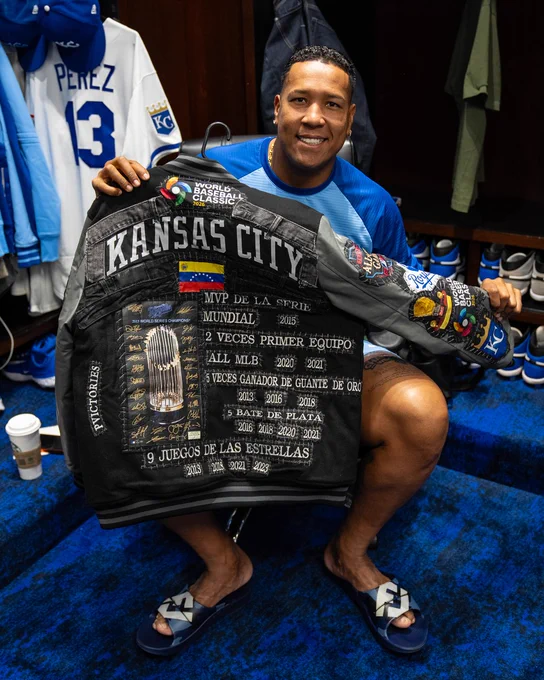 Salvador Perez shows off the details of his jacket. (Photo by Jason Hanna/Kansas City Royals)