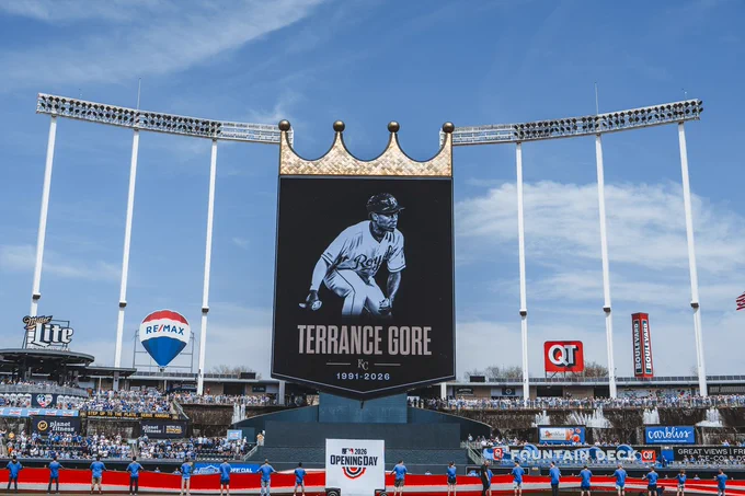 A photo of Kauffman Stadium during a moment of silence in remembrance of the late Terrance Gore. A graphic on the CrownVision video board features a photo of Terrance, and text that reads, "Terrance Gore, 1991-2026." (Photo by Jason Hanna/Kansas City Royals)