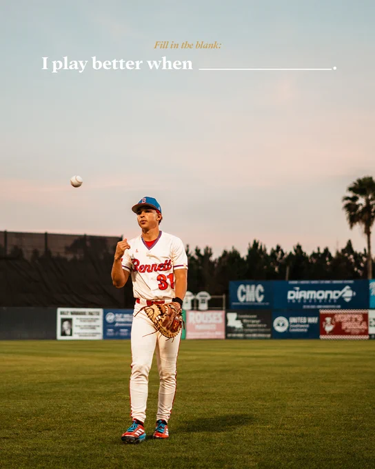 Youth baseball player in a Luccini baseball uniform on a grass field at sunset, holding a glove and tossing a baseball with fill-in-the-blank engagement text on screen.