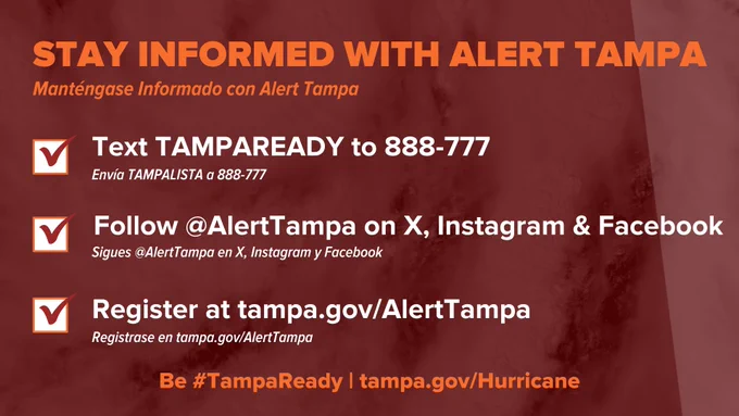Red informational graphic titled "Stay Informed with Alert Tampa." It provides three steps: Text TAMPAREADY to 888-777, follow @AlertTampa on X, Instagram, and Facebook, and register at tampa.gov/AlertTampa. The hashtag #TampaReady is noted at the bottom.