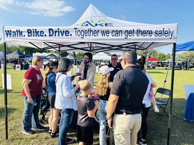 FDOT District Seven booth at 2026 Move With MADD Tampa Bay. Tent: Walk. Bike. Drive. Together we can get there safely. 