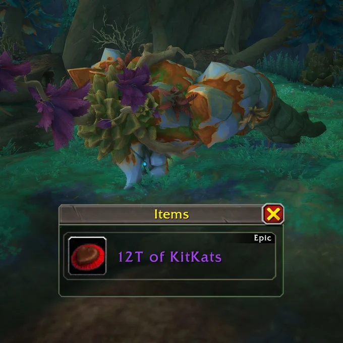 The image features the fallen Cragpine world boss and a loot window in World of Warcraft. On the left-hand side of the window is a chocolate heart resting on a red cushion. The window reads, \"12T of KitKats\" in purple text. The background is a lush clearing \u2014 perfect for taking a crispy, chocolatey break.