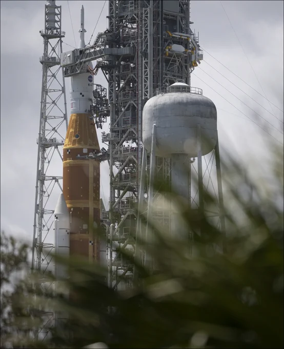 NASA’s Artemis II Space Launch System (SLS) rocket and Orion spacecraft are seen atop a mobile launcher at Launch Complex 39B, Monday, March 30, 2026, as preparations continue for launch at NASA’s Kennedy Space Center in Florida. NASA’s Artemis II test flight will take Commander Reid Wiseman, Pilot Victor Glover, and Mission Specialist Christina Koch from NASA, and Mission Specialist Jeremy Hansen from the CSA (Canadian Space Agency), around the Moon and back to Earth no later than no later than April 2026. Photo Credit: (NASA/Joel Kowsky)
