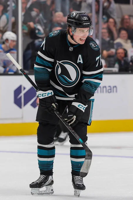 Macklin Celebrini on ice in a Sharks uniform. 