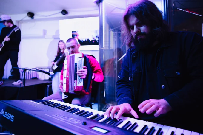 Musicians perform during a live session at a youth creative hub in Kremenchuk, a space that brings people together through music, education, and community activities.