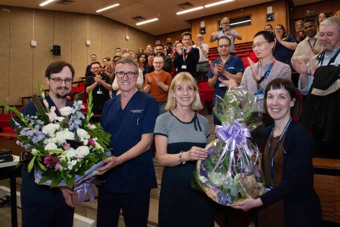Emergency medicine consultants, Professor Tim Coats and Dr Ffion Davies, receiving retirement gifts at the Leicester Royal Infirmary.