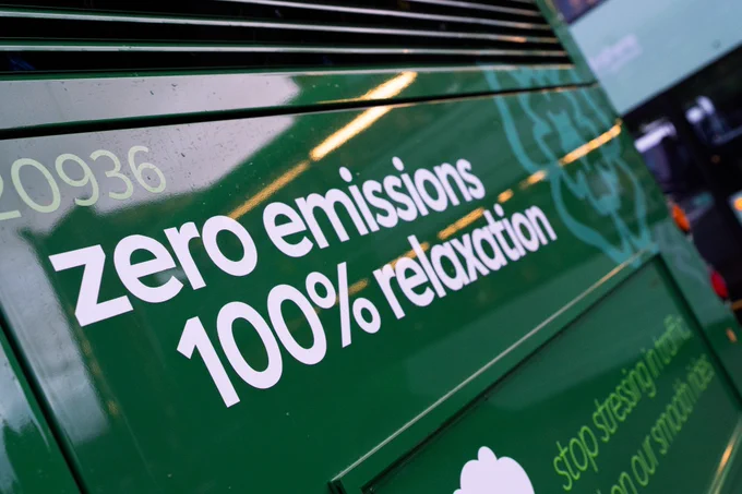 The back of one of the electric buses displaying the message: "zero emissions 100% relaxation".