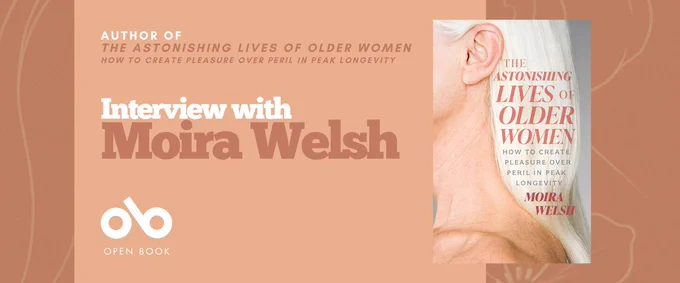 A promotional banner with a peach background featuring the book The Astonishing Lives of Older Women: How to Create Pleasure Over Peril in Peak Longevity by Moira Welsh. The right side shows the book cover with a close-up of an older woman’s face and white hair. On the left, white and brown text reads: “Author of The Astonishing Lives of Older Women — Interview with Moira Welsh.” The Open Book logo appears at the bottom left.